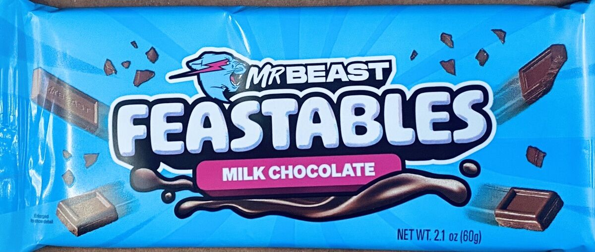 Feastables chocolate bars by Mr. Beast displayed on a store shelf, highlighting the popular YouTube creator’s brand